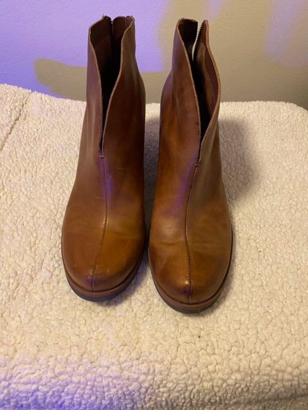 Korks Gemini leather ankle booties feature a distinct front V-slit
